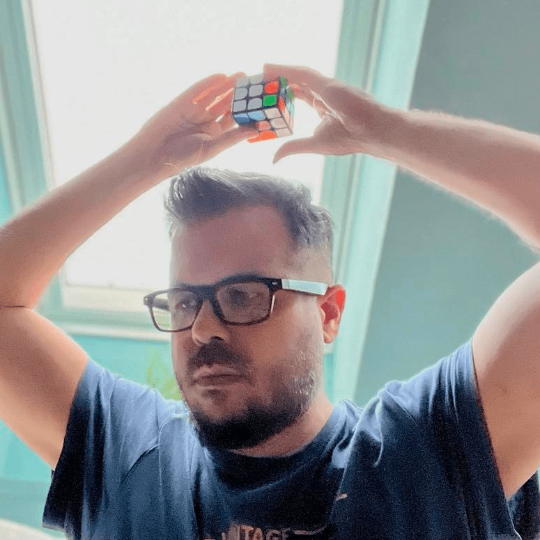 Solving a CubeSmith Rubik's cube above the head, wearing Vision glasses