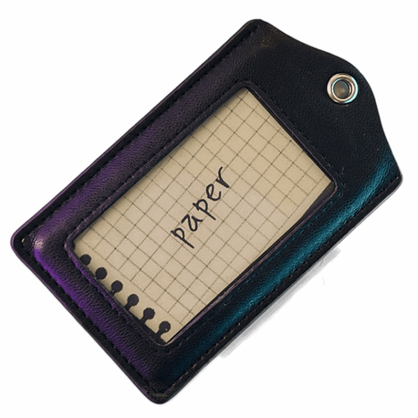 a leather tag with a piece of paper in it